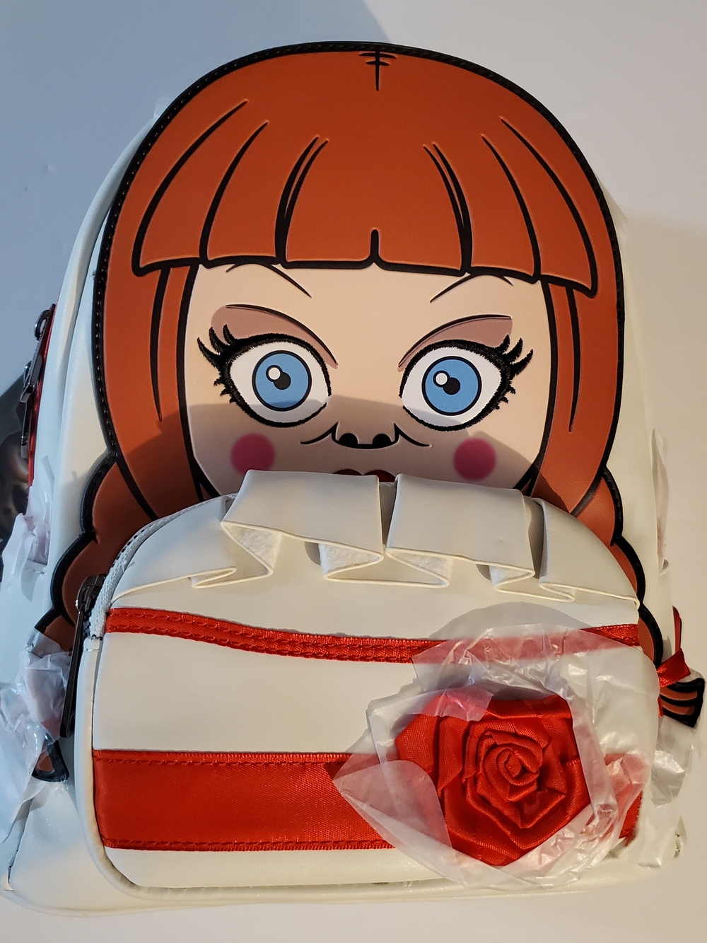 Loungefly Annabelle Comes Home Mini Backpack Doll Face Design